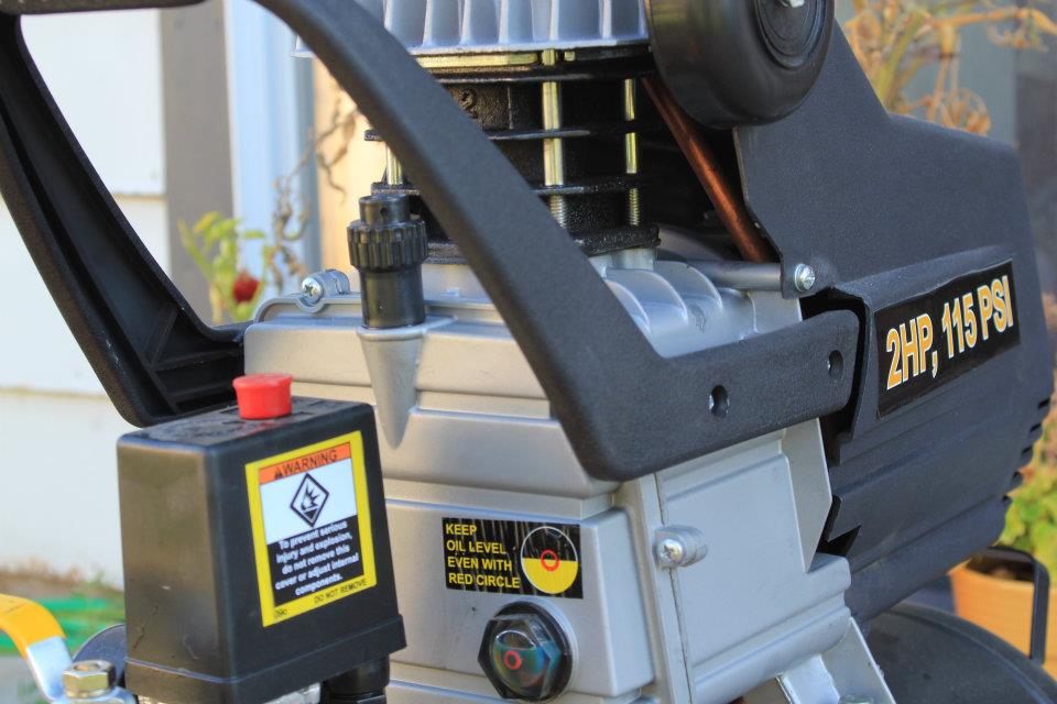 photo of turning on air compressor